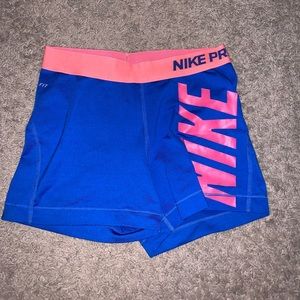 Blue and pink nike pros